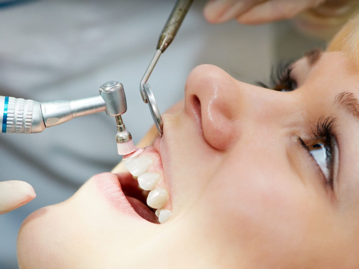 Patient receiving dental cleaning